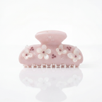 Decorative hair clip with floral designs on a white background

