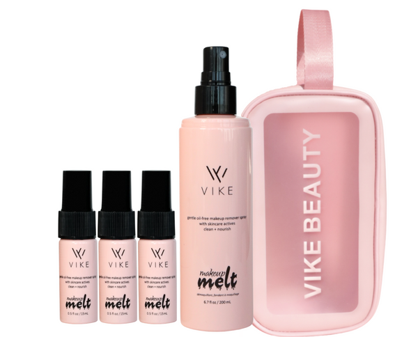 A collection of beauty products by VIKE Beauty, including a travel bag and several bottles of Makeup Melt in different sizes, all in a matching soft pink color scheme.

